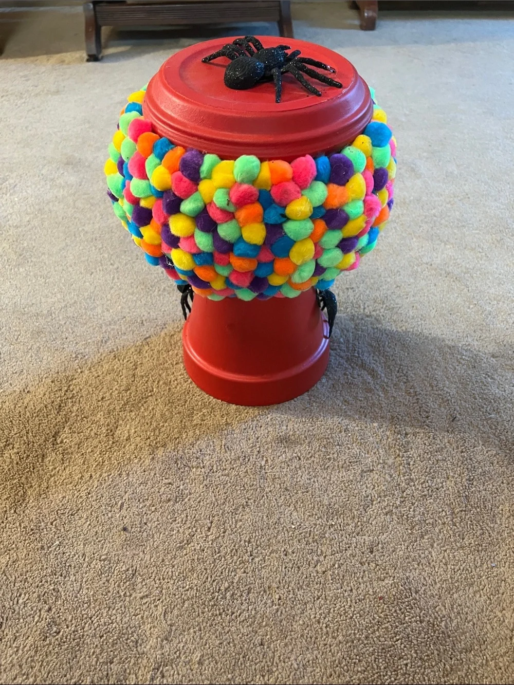 Red Gumball Toy Machine with Multicolor Pom-Pom Cover with Spiders